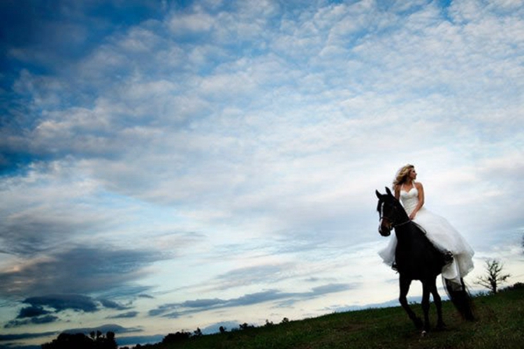 bride riding a horse